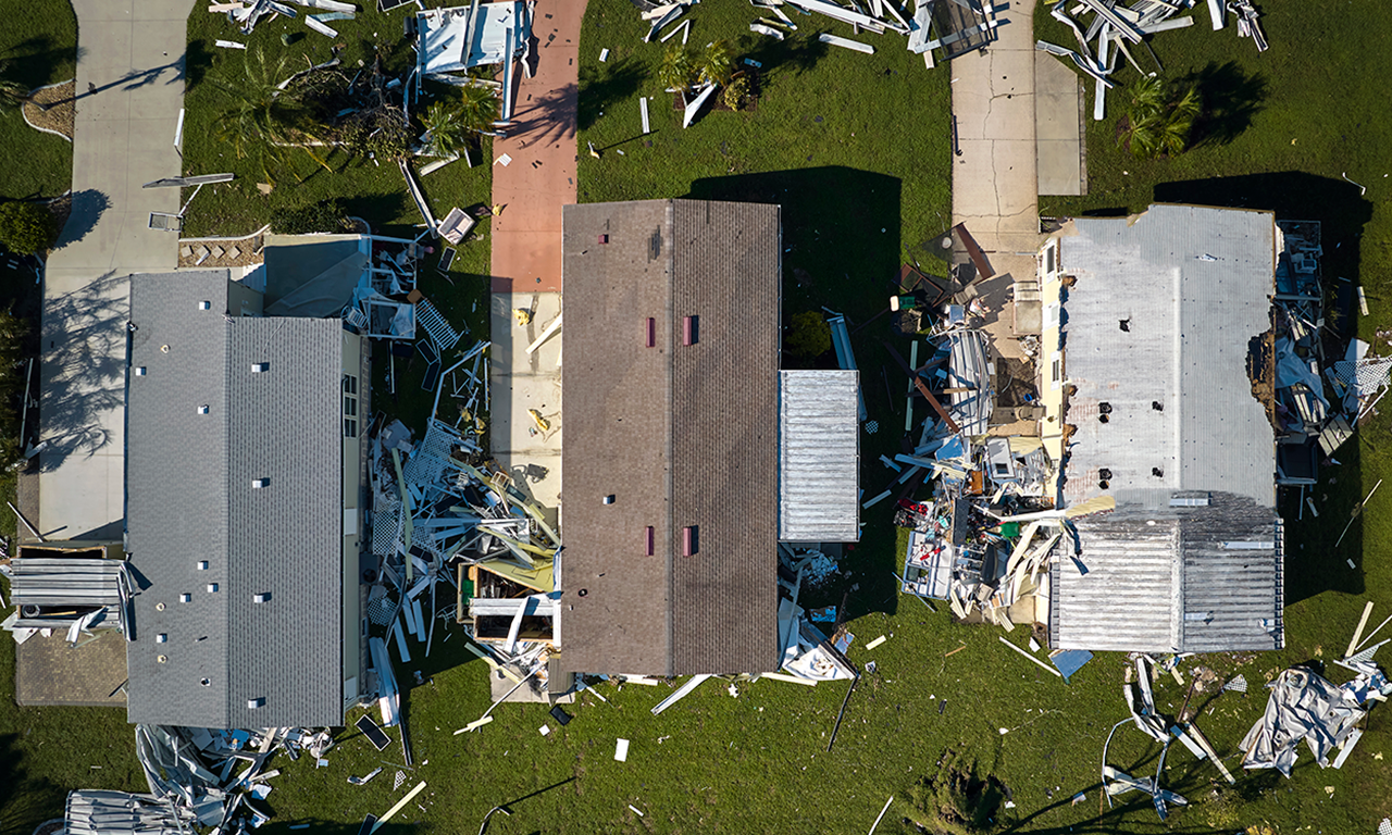 Aerial view of residential properties damaged by a cyclone