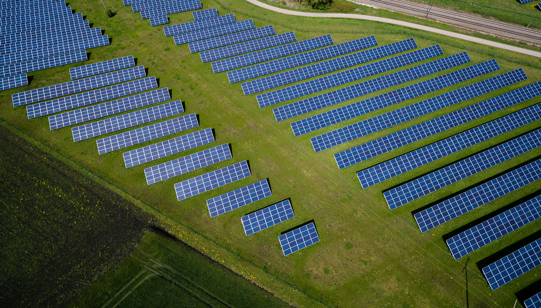 Aerial view of solar panels in a field